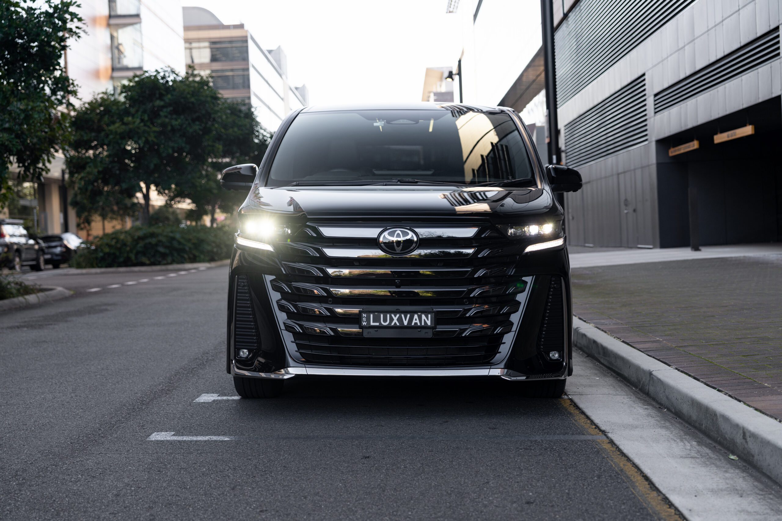 Front view of a luxury Toyota Alphard chauffeur vehicle in Sydney for airport transfers, corporate travel, VIP and family transport.
